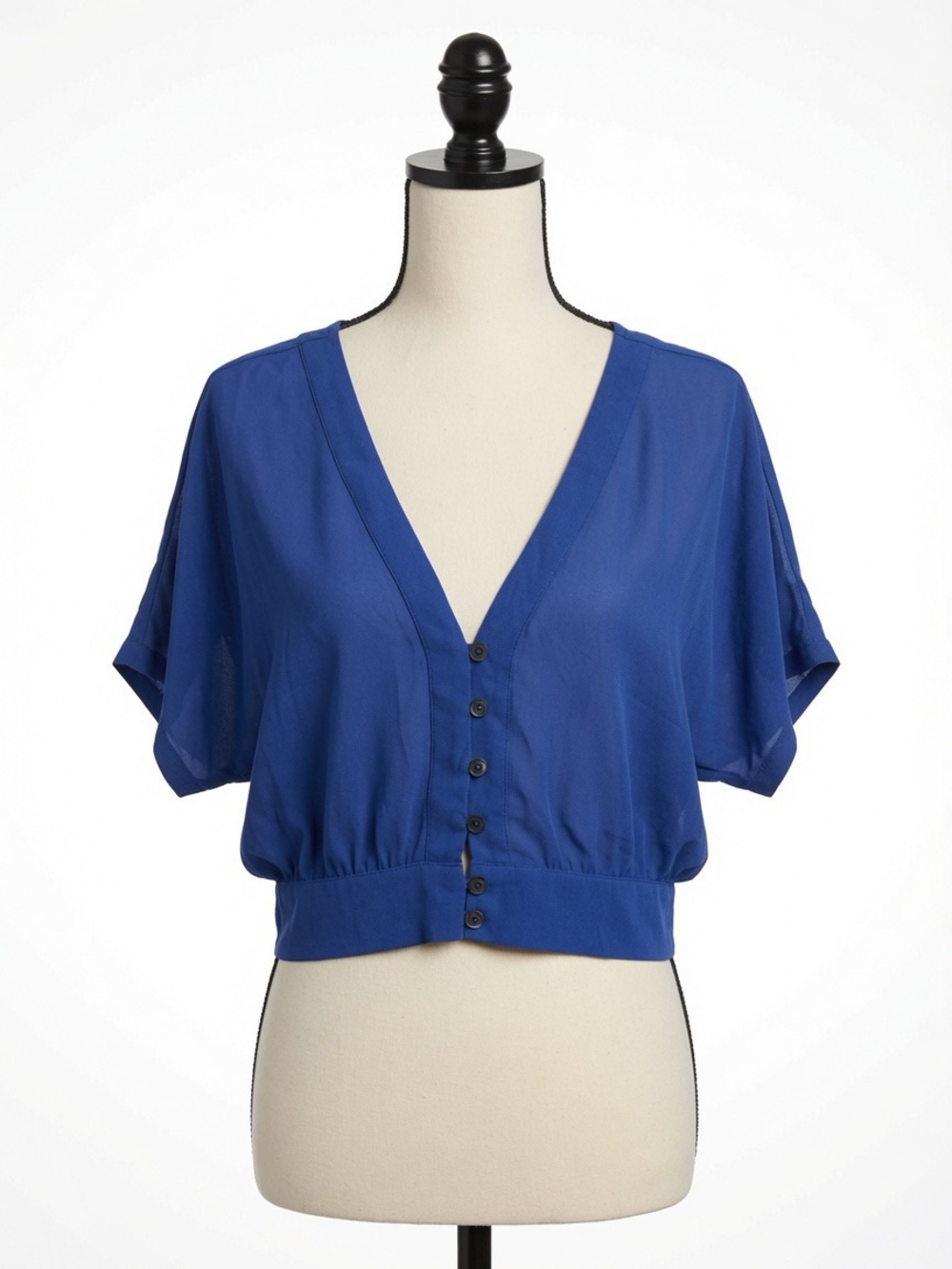the clothing company Cobalt V-Neck Button Front Cropped Blouse